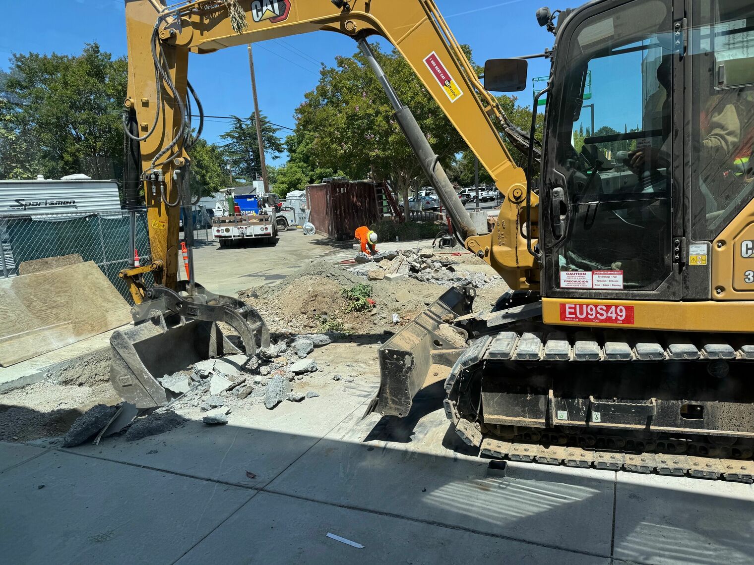 Heavy equipment demoes old kinder yard.