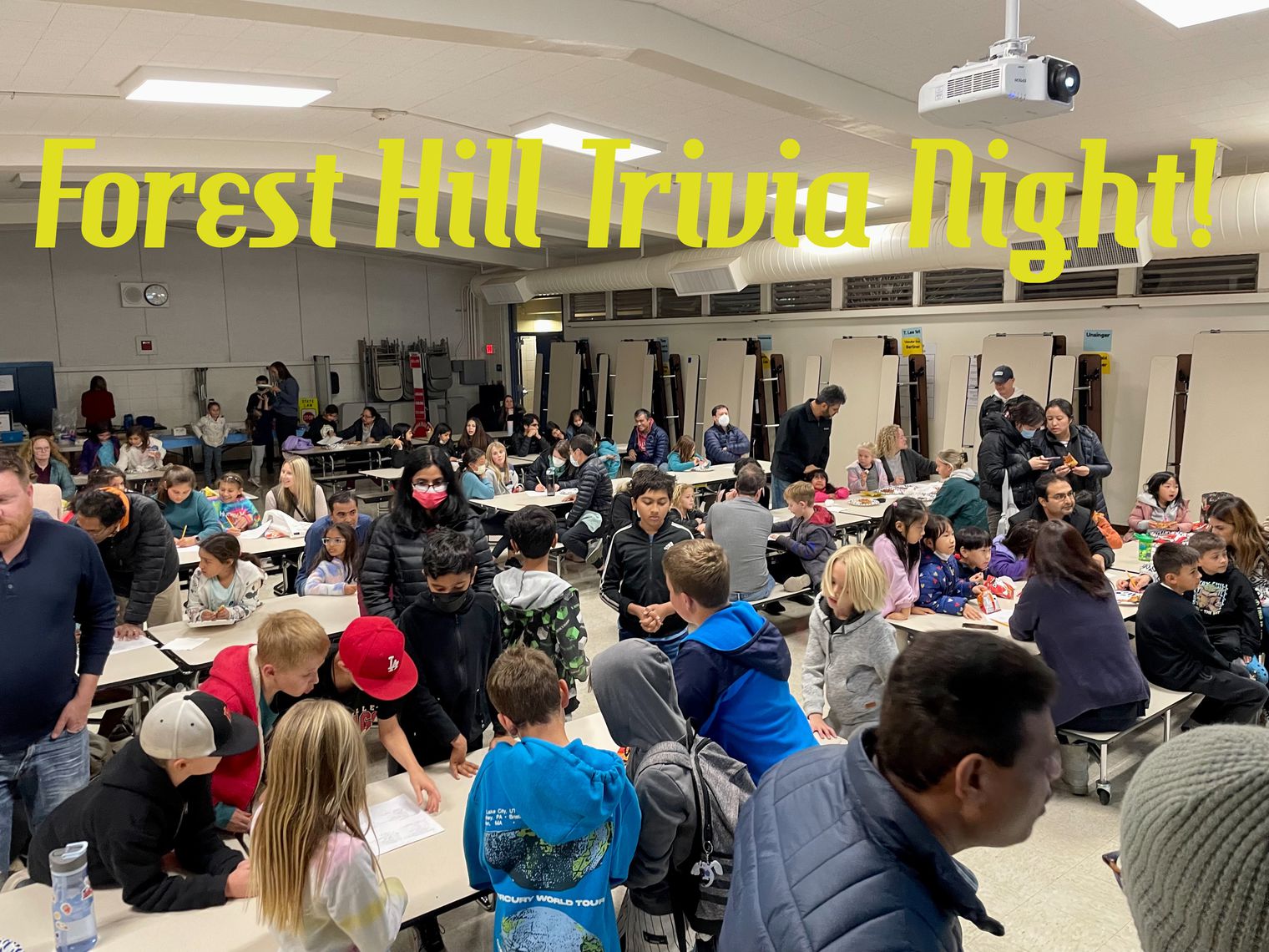 students and parents at cafeteria tables