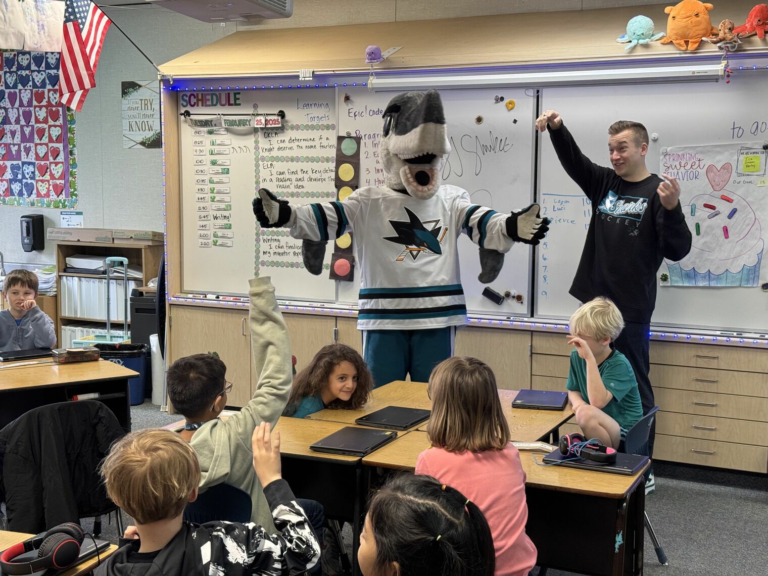 Sharkie congratulates 2nd grade students.