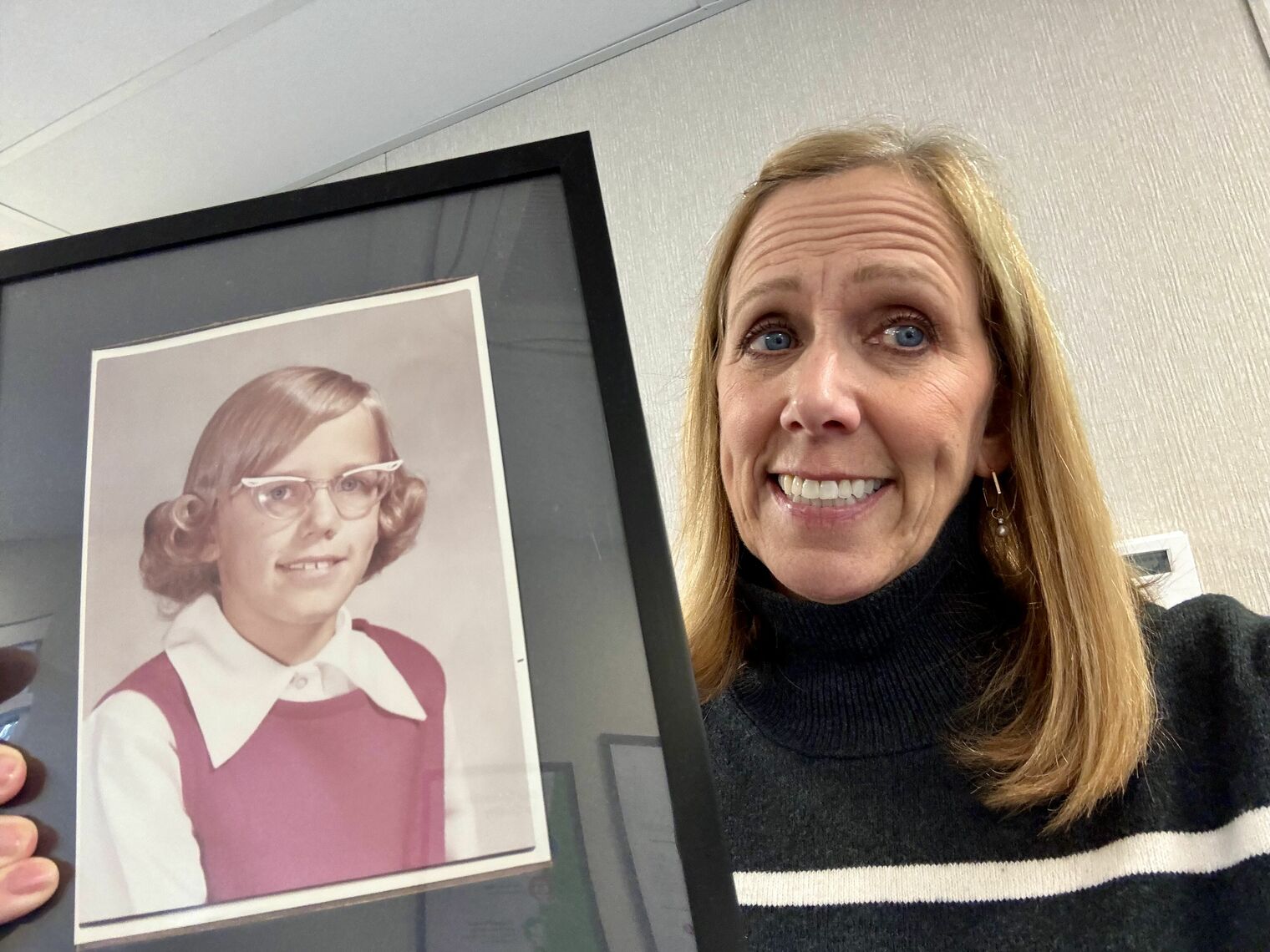Principal Burbank with her 3rd grade picture.