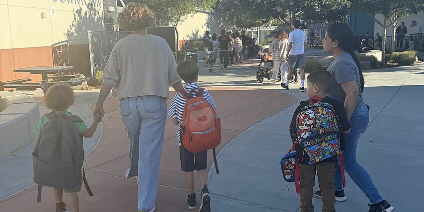 Parents walking students to class on the first day of school