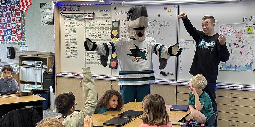 Sharkie congratulates 2nd grade students.