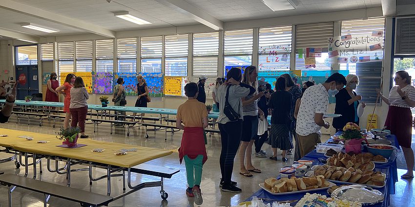 Adults socializing in the cafeteria