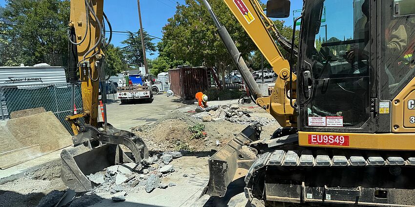 Heavy equipment demoes old kinder yard.