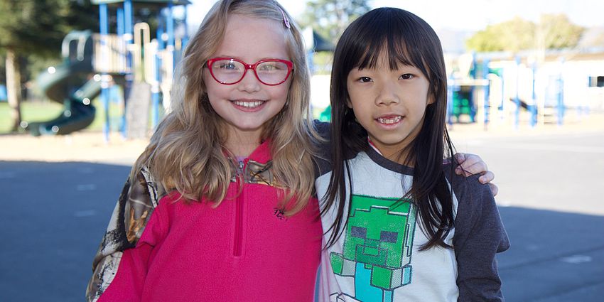 two girls smiling