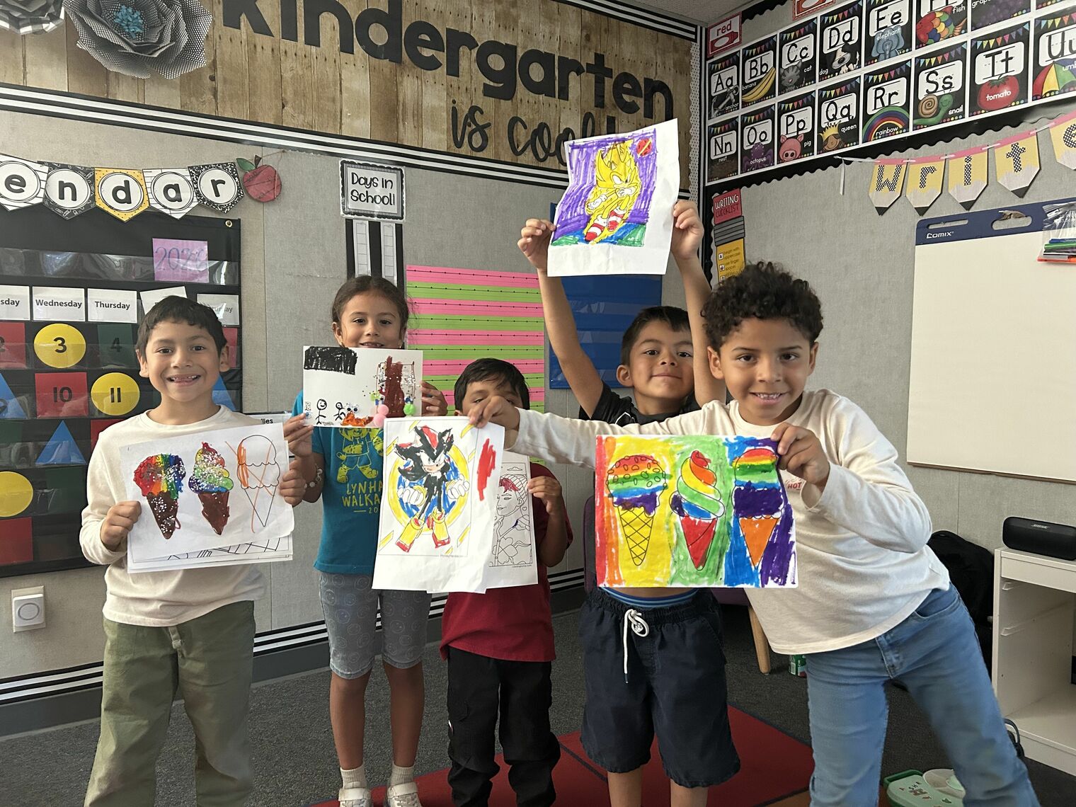 Students show off their colorful artwork
