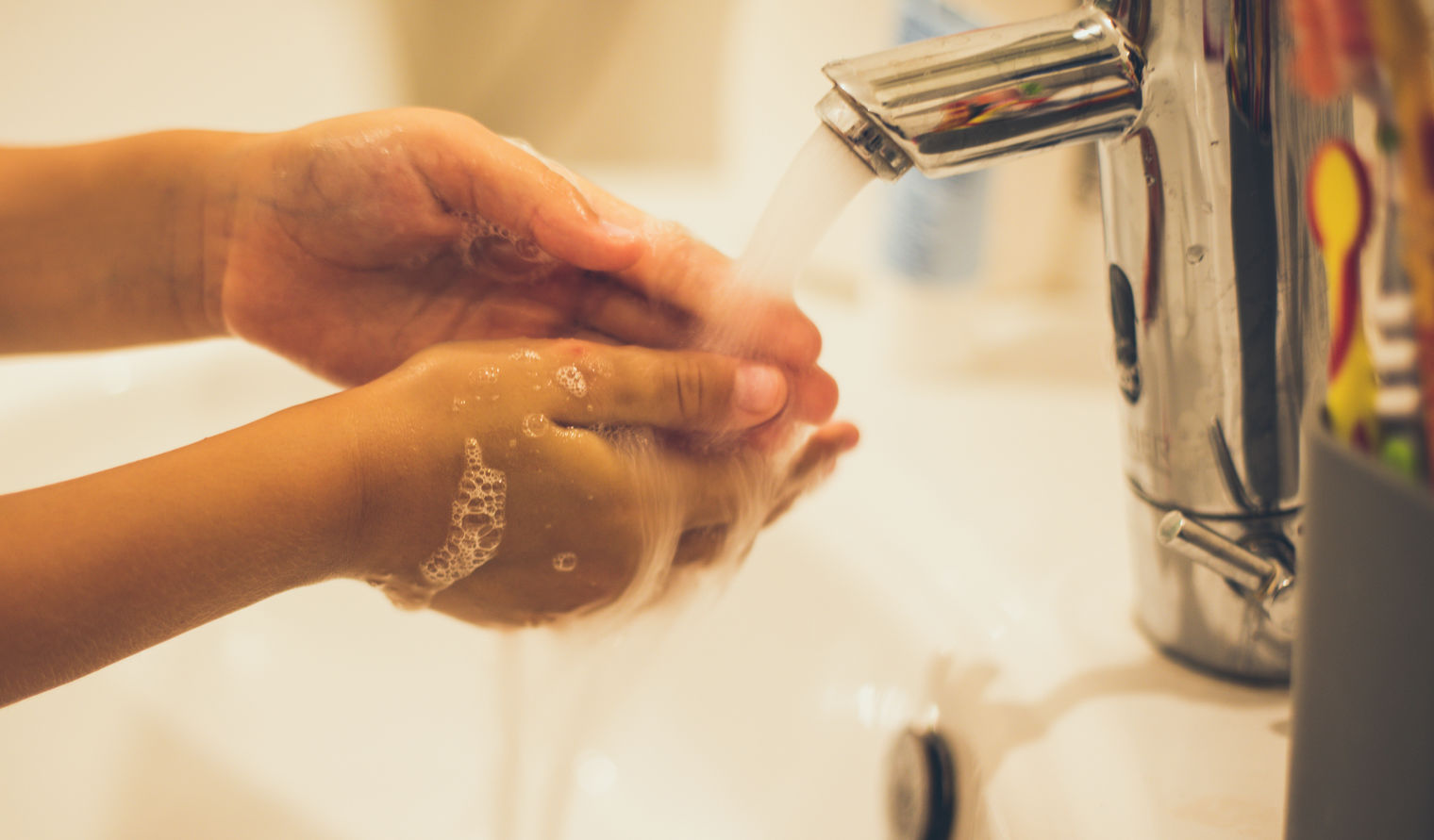 child washing hands