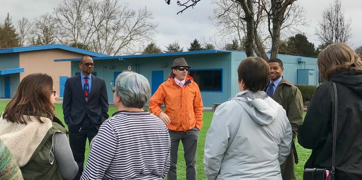 transformation team members touring school campus